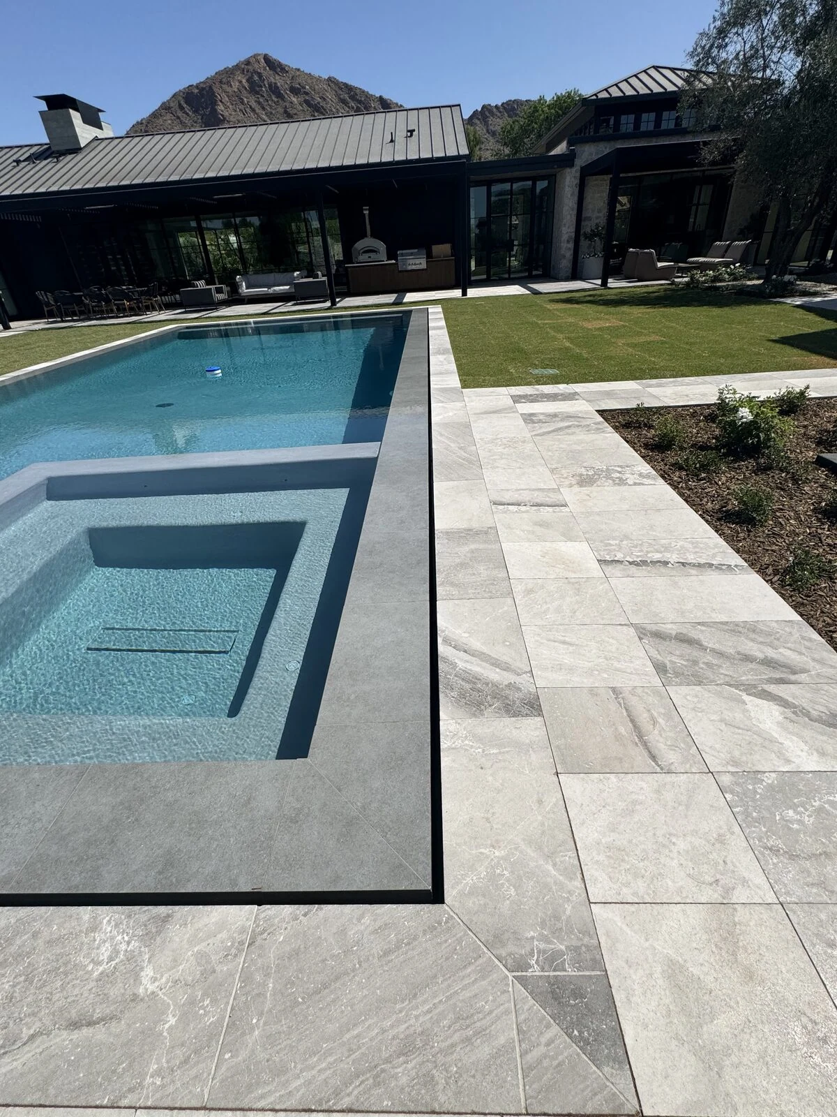 Travertine pool deck built by Sun America Pools & Spas in Gilbert, AZ